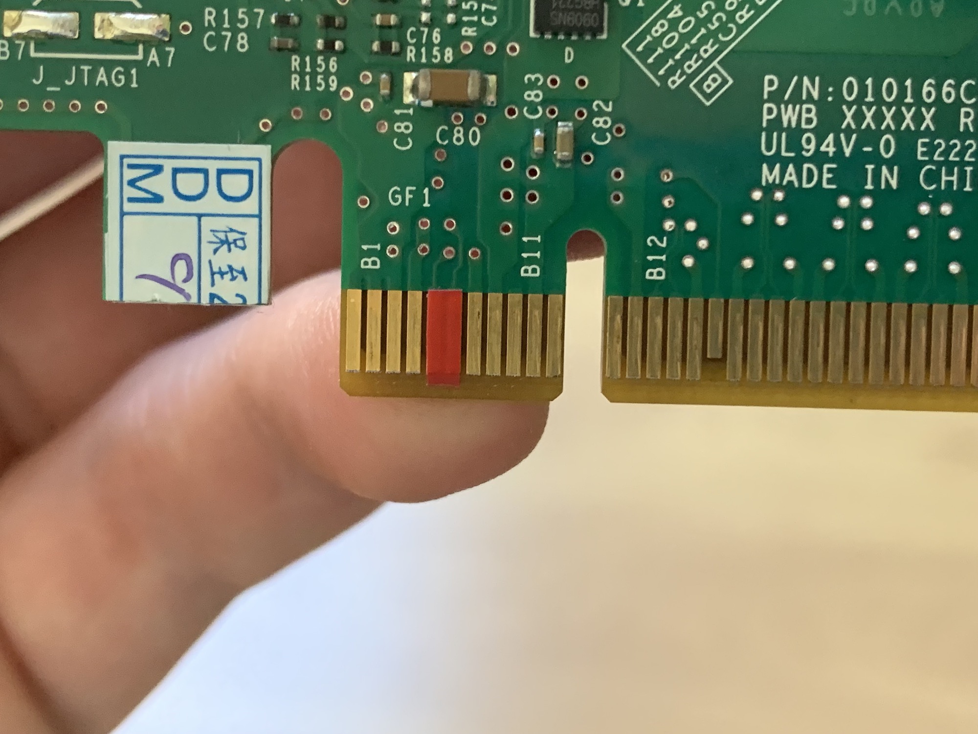 Taping PCI pins to make this card work on non-Dell hardware
